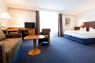 Ein Bett oder Betten in einem Zimmer der Unterkunft domus Hotel