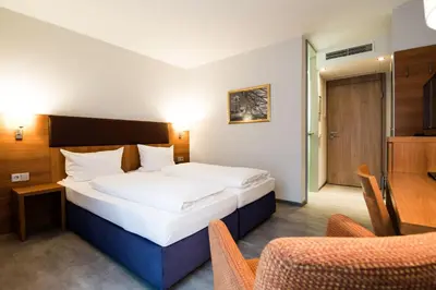 Ein Bett oder Betten in einem Zimmer der Unterkunft domus Hotel