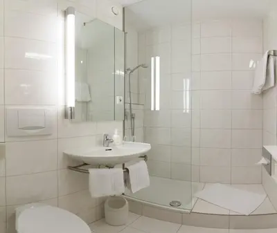 Ein Badezimmer in der Unterkunft domus Hotel