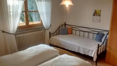 Ein Bett oder Betten in einem Zimmer der Unterkunft Schneiderhof