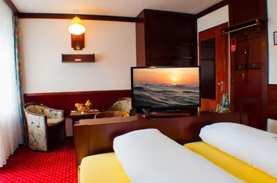Ein Bett oder Betten in einem Zimmer der Unterkunft Kurhotel Wiedenmann