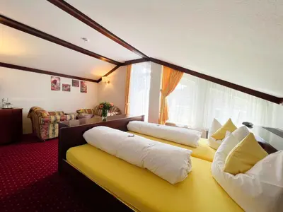 Ein Bett oder Betten in einem Zimmer der Unterkunft Kurhotel Wiedenmann