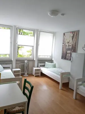 Ein Bett oder Betten in einem Zimmer der Unterkunft PM-Rooms