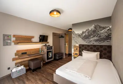 Ein Bett oder Betten in einem Zimmer der Unterkunft Arcus Hotel München Messe