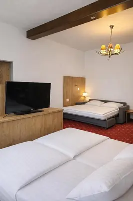 Ein Bett oder Betten in einem Zimmer der Unterkunft Gasthof Klement
