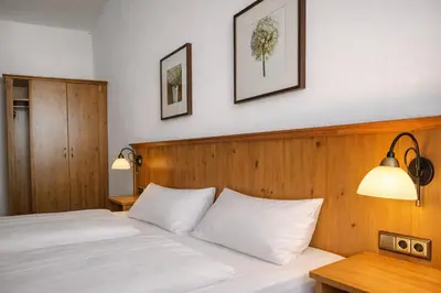 Ein Bett oder Betten in einem Zimmer der Unterkunft Gasthof Klement