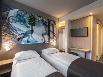 Ein Bett oder Betten in einem Zimmer der Unterkunft B&B Hotel München-Olympiapark
