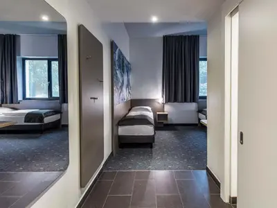 Ein Bett oder Betten in einem Zimmer der Unterkunft B&B Hotel München-Olympiapark