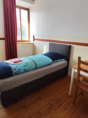 Ein Bett oder Betten in einem Zimmer der Unterkunft Mama Leone