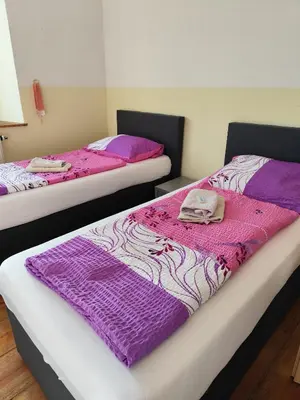 Ein Bett oder Betten in einem Zimmer der Unterkunft Mama Leone