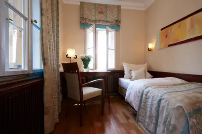Ein Bett oder Betten in einem Zimmer der Unterkunft LA VILLA am Starnberger See