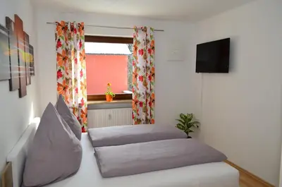 Ein Bett oder Betten in einem Zimmer der Unterkunft Ferienwohnung Gabler