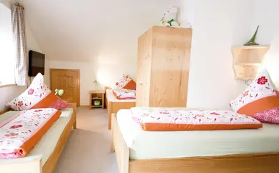 Ein Bett oder Betten in einem Zimmer der Unterkunft Ferienwohnung Erhard