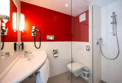 Ein Badezimmer in der Unterkunft Ibis München Airport Süd