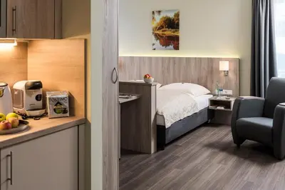 Küche/Küchenzeile in der Unterkunft AINO Aparthotel Olympiapark