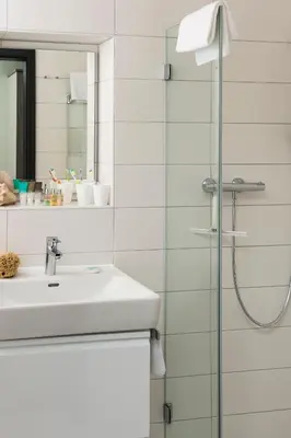 Ein Badezimmer in der Unterkunft AINO Aparthotel Olympiapark