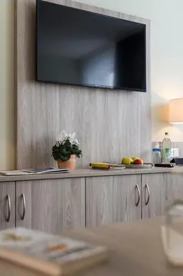 TV/Unterhaltungsangebot in der Unterkunft AINO Aparthotel Olympiapark