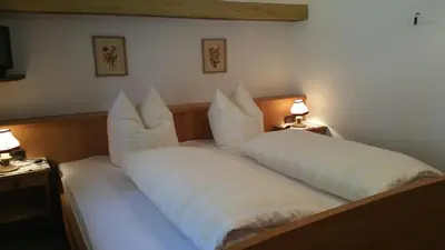 Ein Bett oder Betten in einem Zimmer der Unterkunft Villa Bergkristall