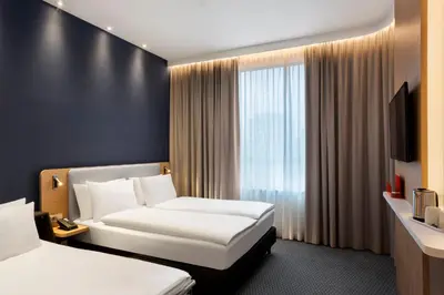 Ein Bett oder Betten in einem Zimmer der Unterkunft Holiday Inn Express Munich City West by IHG