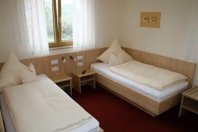 Ein Bett oder Betten in einem Zimmer der Unterkunft Landhotel Winter