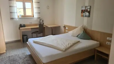 Ein Bett oder Betten in einem Zimmer der Unterkunft Landhotel Winter