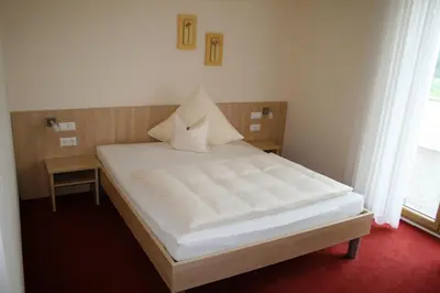 Ein Bett oder Betten in einem Zimmer der Unterkunft Landhotel Winter