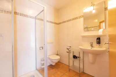 Ein Badezimmer in der Unterkunft Gästehaus Guggenberger