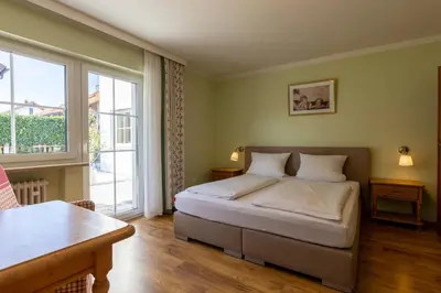 Ein Bett oder Betten in einem Zimmer der Unterkunft Gästehaus Guggenberger