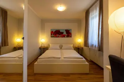 Ein Bett oder Betten in einem Zimmer der Unterkunft Gästehaus Guggenberger