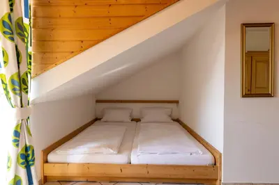 Ein Bett oder Betten in einem Zimmer der Unterkunft Gästehaus Guggenberger