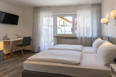 Ein Bett oder Betten in einem Zimmer der Unterkunft Gästehaus Guggenberger