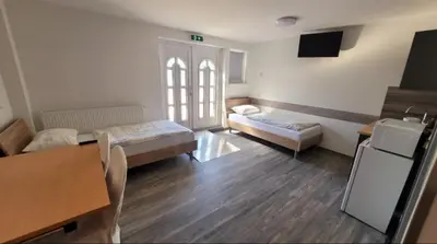 Ein Bett oder Betten in einem Zimmer der Unterkunft Drei Bären Hotel & Apartments