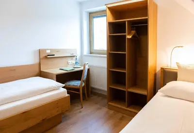 Ein Bett oder Betten in einem Zimmer der Unterkunft Hotel Gasthof Rosenwirt