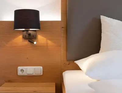 Ein Bett oder Betten in einem Zimmer der Unterkunft Hotel Gasthof Rosenwirt