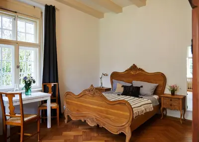 Ein Bett oder Betten in einem Zimmer der Unterkunft Schloss Mörlbach
