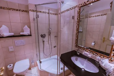 Ein Badezimmer in der Unterkunft Hotel Kandler