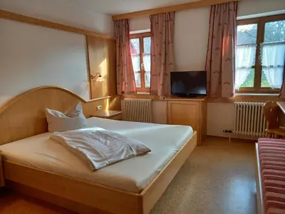 Ein Bett oder Betten in einem Zimmer der Unterkunft Gasthof Huberwirt GmbH