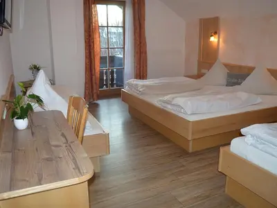 Ein Bett oder Betten in einem Zimmer der Unterkunft Gasthof Huberwirt GmbH