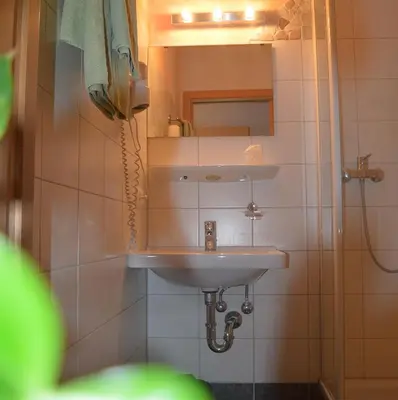 Ein Badezimmer in der Unterkunft Gasthof Huberwirt GmbH