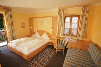 Ein Bett oder Betten in einem Zimmer der Unterkunft Gasthof Huberwirt GmbH
