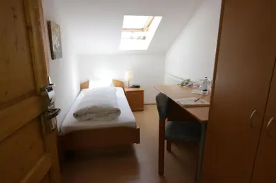 Ein Bett oder Betten in einem Zimmer der Unterkunft Landgasthof Pauliwirt