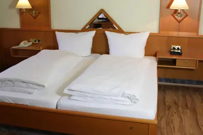 Ein Bett oder Betten in einem Zimmer der Unterkunft Landgasthof Pauliwirt
