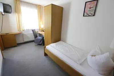 Ein Bett oder Betten in einem Zimmer der Unterkunft Landgasthof Pauliwirt