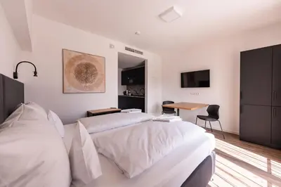 Ein Bett oder Betten in einem Zimmer der Unterkunft Living Neuburg
