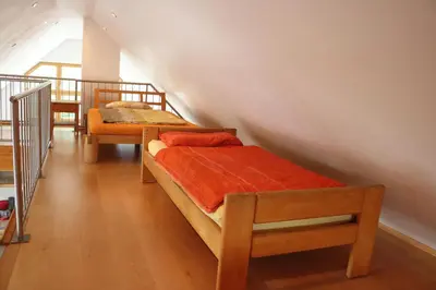 Ein Bett oder Betten in einem Zimmer der Unterkunft Apartment Dachgalerie 110 m2