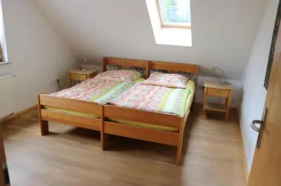Ein Bett oder Betten in einem Zimmer der Unterkunft Apartment Dachgalerie 110 m2