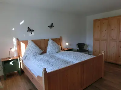 Ein Bett oder Betten in einem Zimmer der Unterkunft Ferienwohnung Am Verlorenen Bach