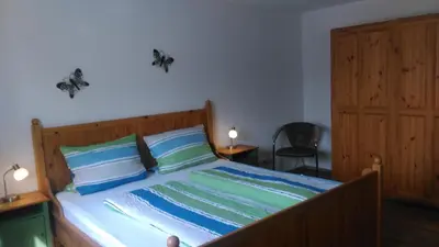 Ein Bett oder Betten in einem Zimmer der Unterkunft Ferienwohnung Am Verlorenen Bach