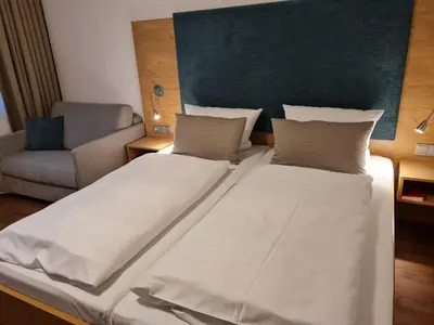 Ein Bett oder Betten in einem Zimmer der Unterkunft Hotel garni Sterff