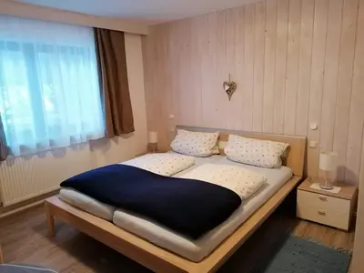Ein Bett oder Betten in einem Zimmer der Unterkunft Gästehaus Pöppl